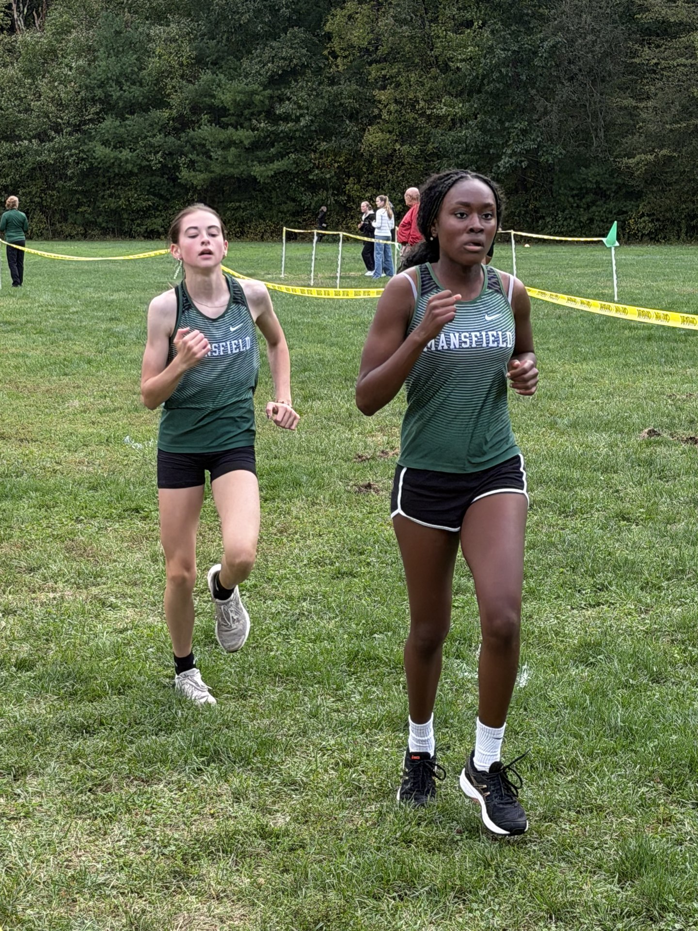 Two Mansfield runners following the taped route.