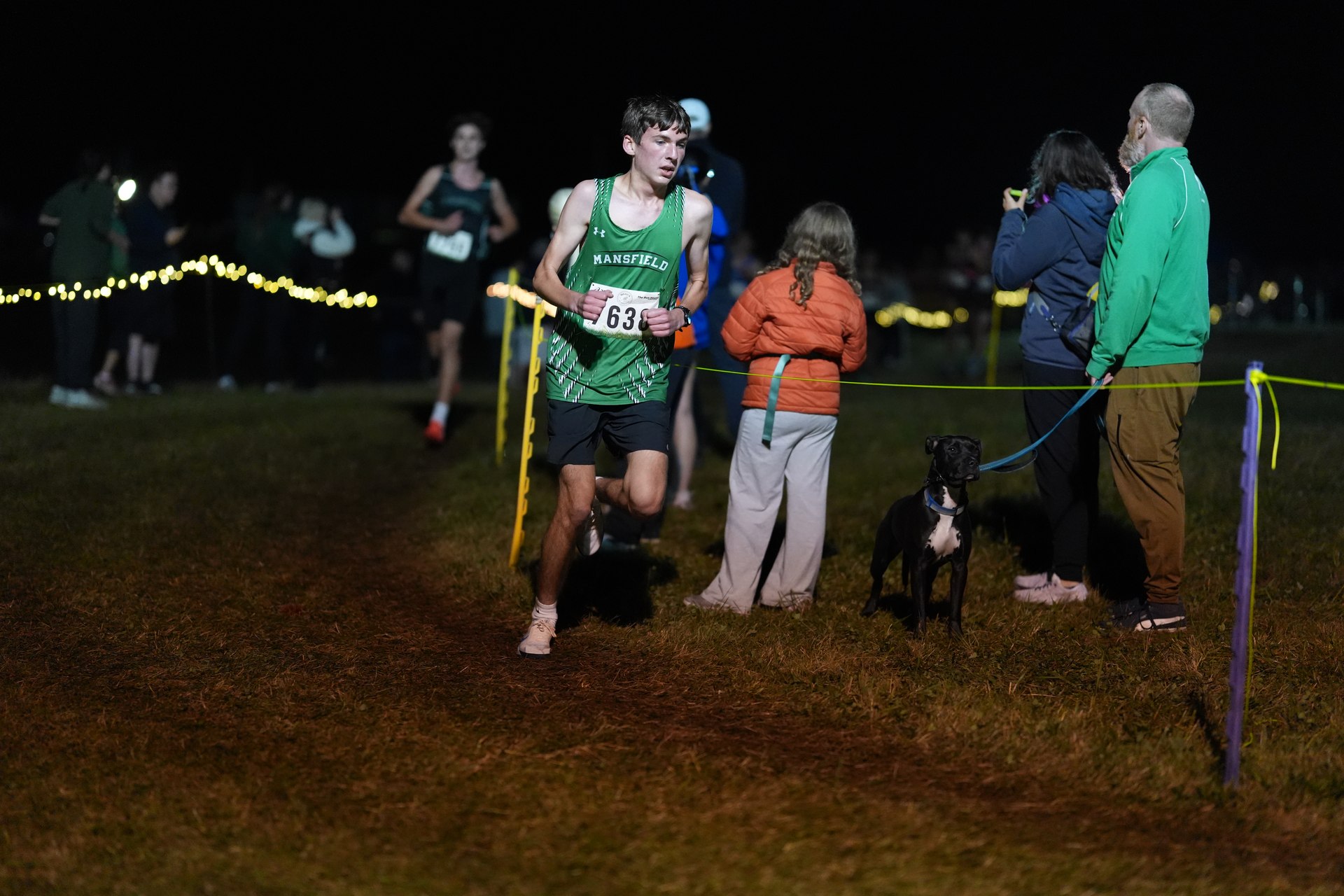Everett Foster comes through beside the spectators.