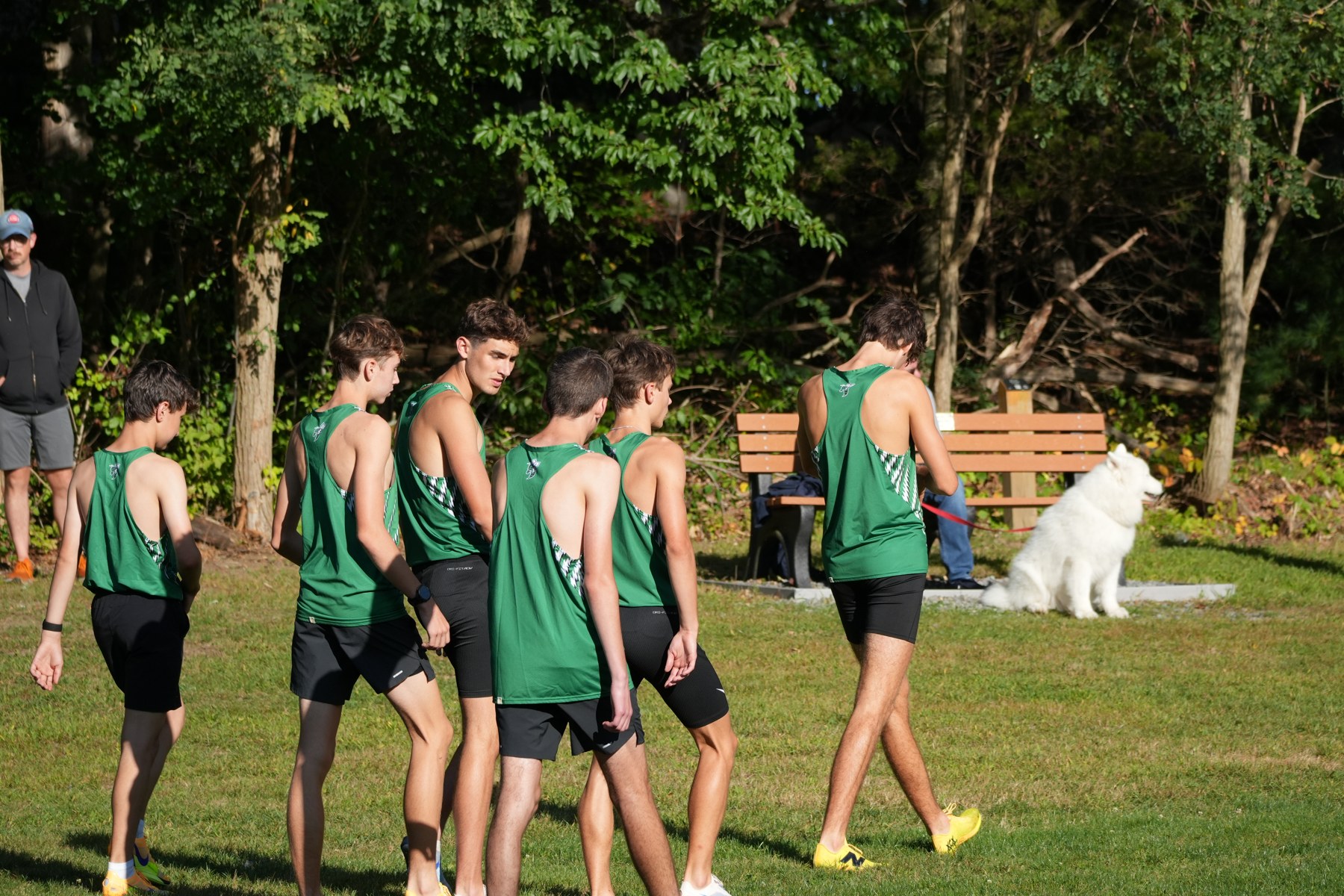 Mansfield boys walking together on the grass.