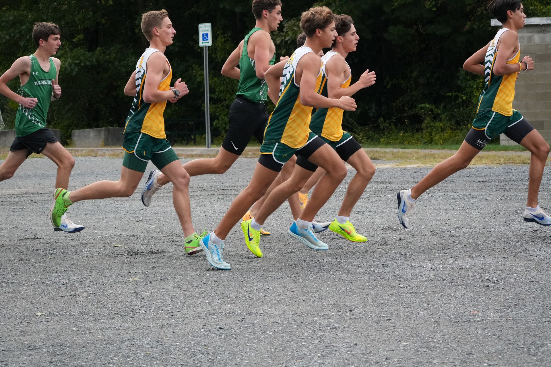 Mansfield and King Philip runners crossing the gravel.