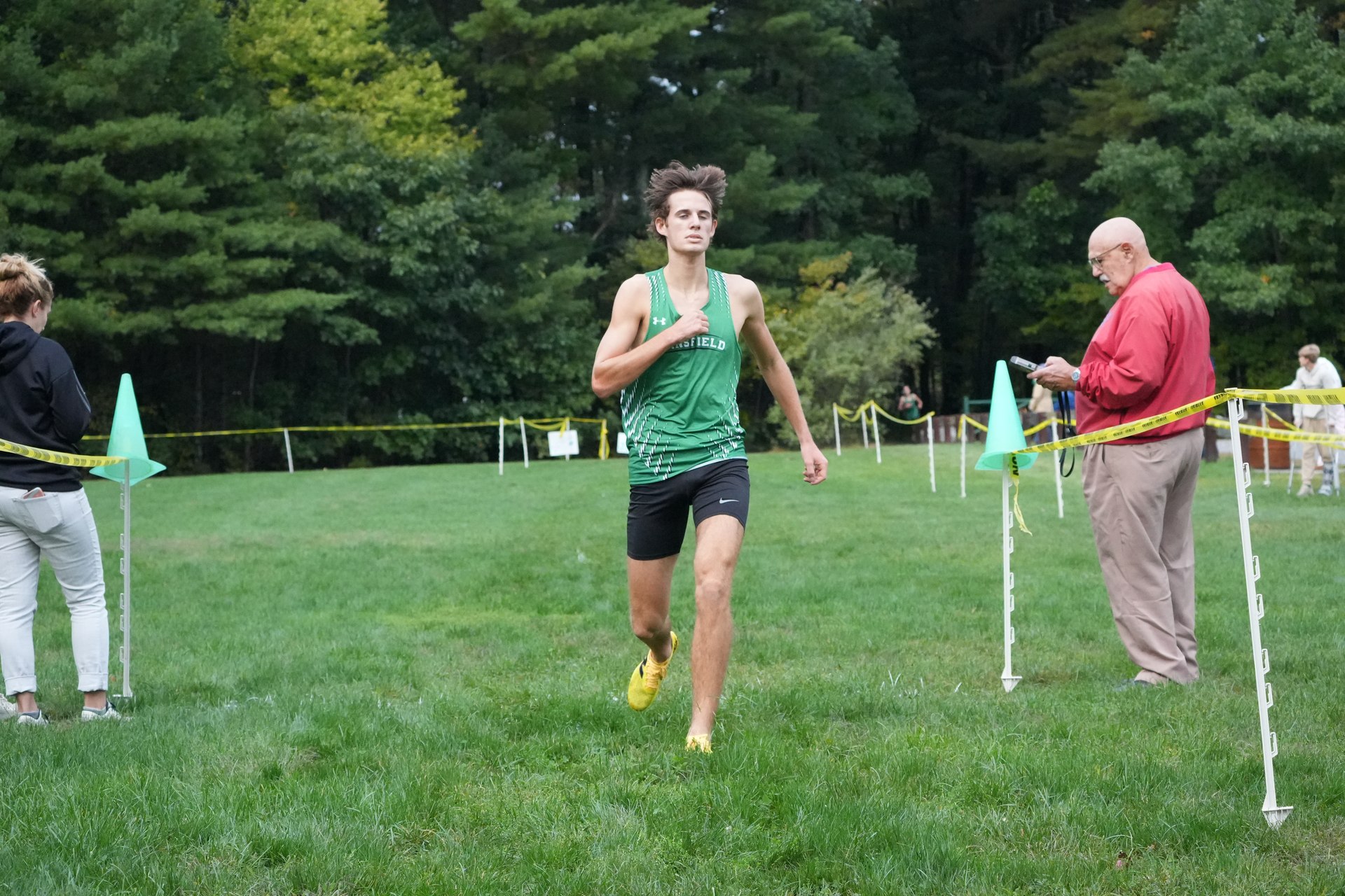 Another Mansfield runner reaching the finish lane.